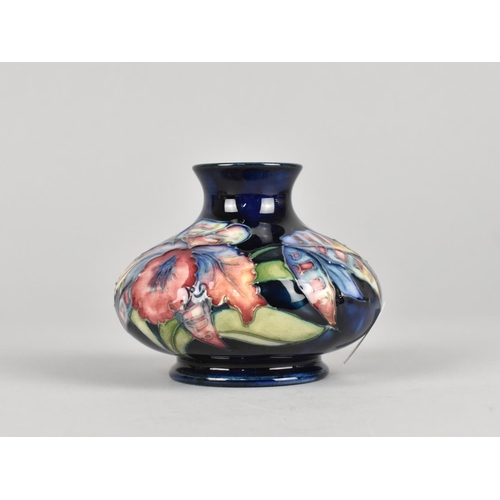 423 - A Moorcroft Vase, Orchid Pattern, 7cm high