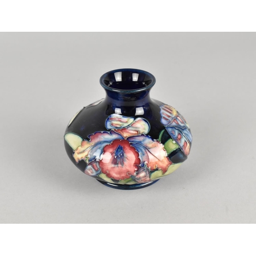 423 - A Moorcroft Vase, Orchid Pattern, 7cm high