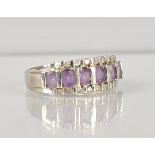 488 - An Amethyst and Diamond Cocktail Ring, Central Row of Seven Oval Cut Amethyst Stones, Each 3.9mm by ... 