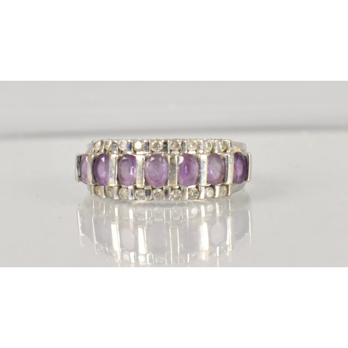 488 - An Amethyst and Diamond Cocktail Ring, Central Row of Seven Oval Cut Amethyst Stones, Each 3.9mm by ... 