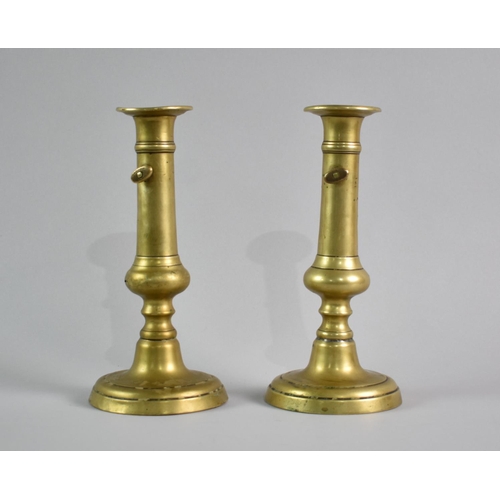 50 - A Pair of 19th Century Brass Candlesticks with Twist Candle Grippers, 22cms High