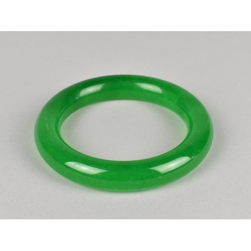 503 - A Contemporary Simulated Jade Green Stone Bangle, Interior Dimensions 61mm