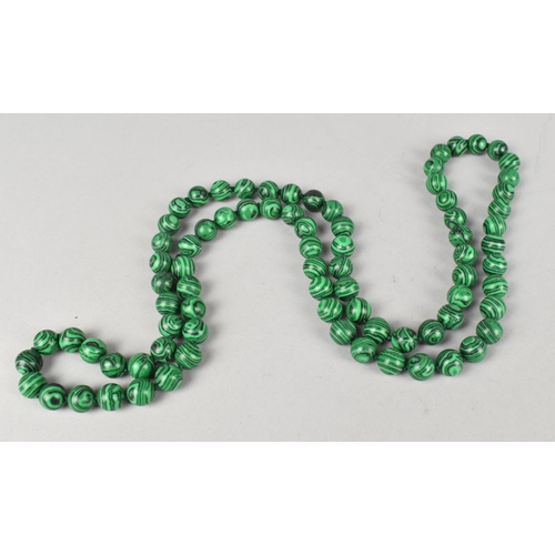 504 - A String of Faux Malachite Beads on a Knotted Green Thread, 86cms Long Approx