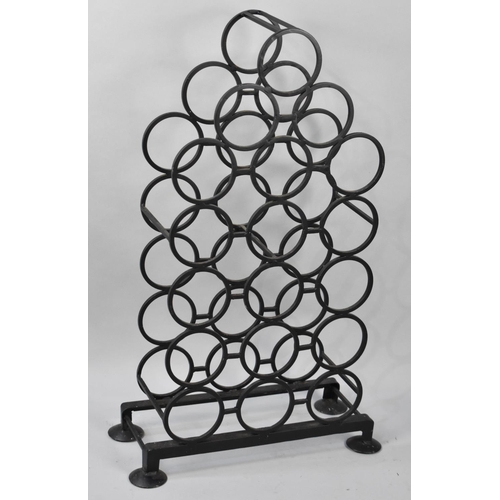 521 - A Wrought Metal Eighteen Bottle Wine Rack, 84cm high