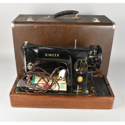 526 - A Cased Singer Electric Sewing Machine