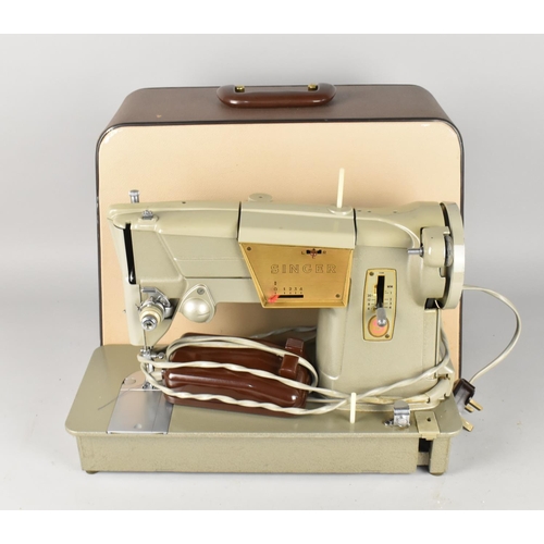 527 - A 1960's Electric Singer Sewing Machine in Case