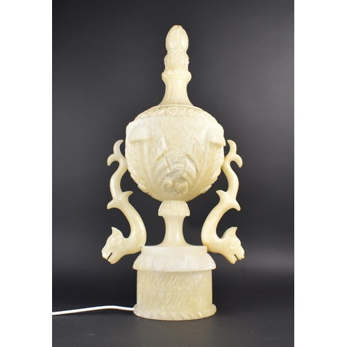 573 - A Carved Stone Table Lamp Base of Urn Form with Zoomorphic Handles, 64cm high