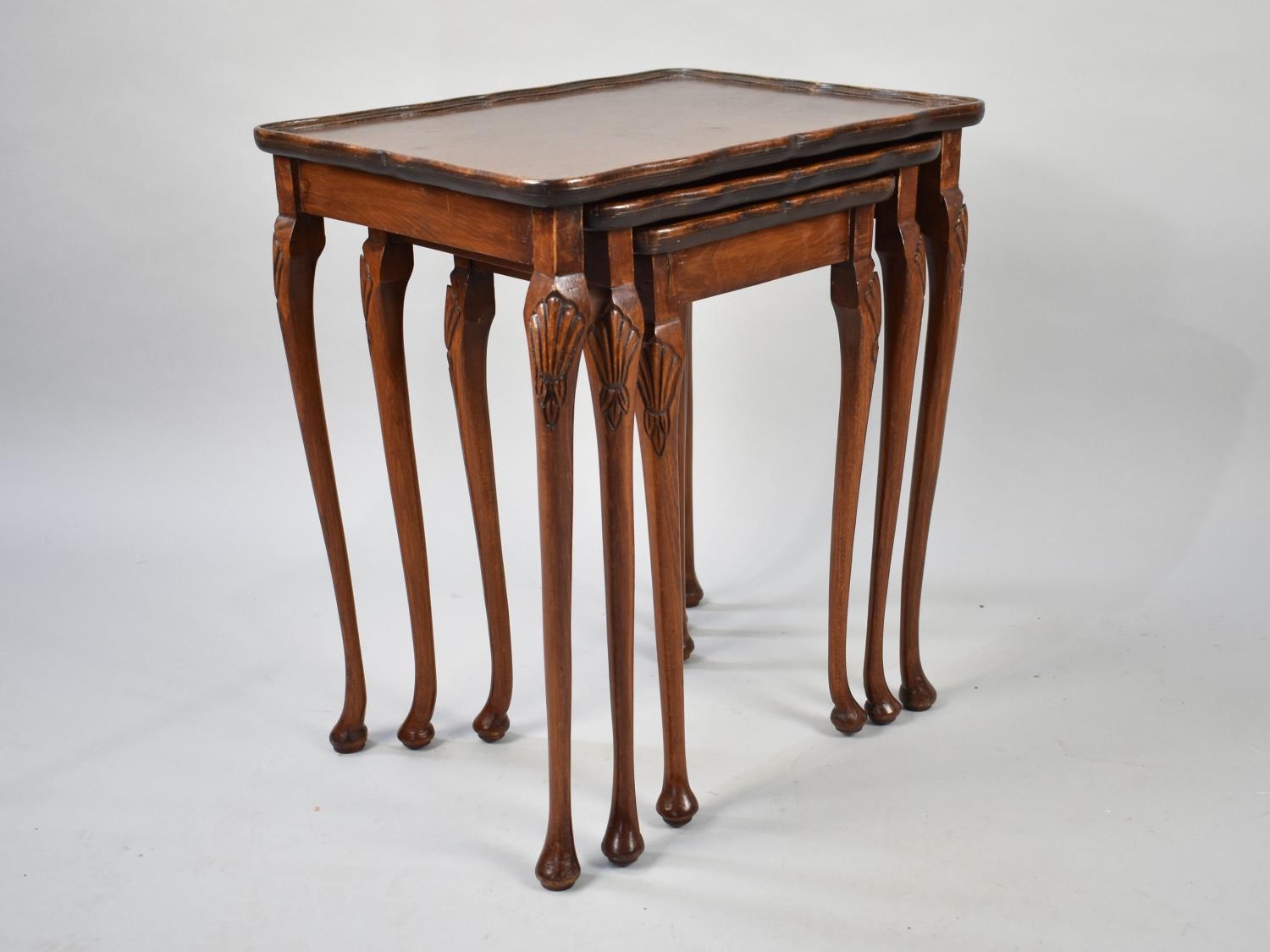 A Mid Th Century Mahogany Nest Of Three Tables Cms Wide