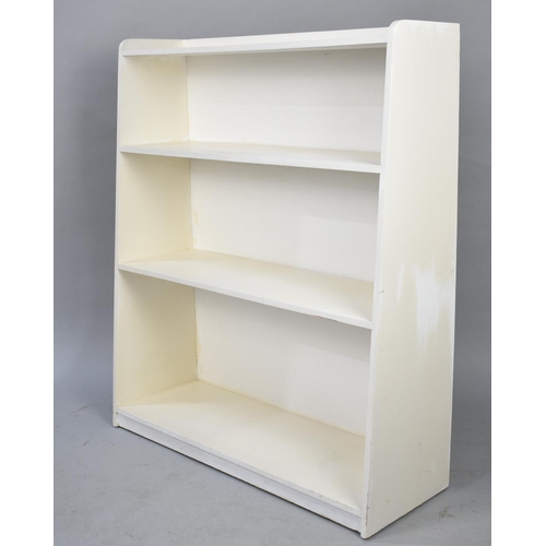 605 - A Cream Painted Three Shelf Waterfall Bookcase, 75cms Wide