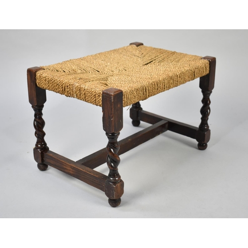 62 - A Mid 20th Century Oak Framed Rush Seated Rectangular Stool with Barley Twist Supports, 45cms Wide