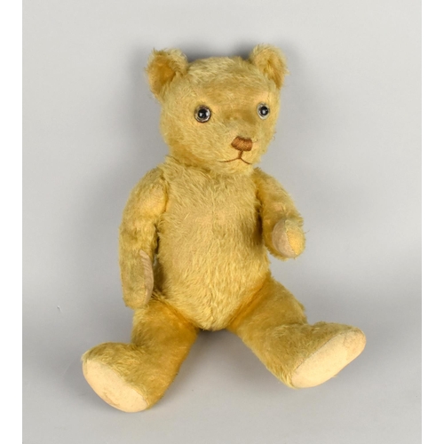 63 - A Vintage Straw Filled Plush Teddy Bear with Glass Eyes, 44cms High