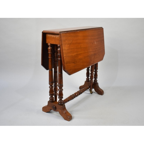 76 - A Late Victorian/Edwardian Mahogany Drop Leaf Sutherland Table with Turned Supports, 59cms Wide