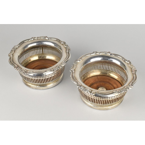 31 - A Pair of Sheffield Plated Wine Coasters with Turned Wooden Bases, Pierced Bellies and Scrolled Trim... 