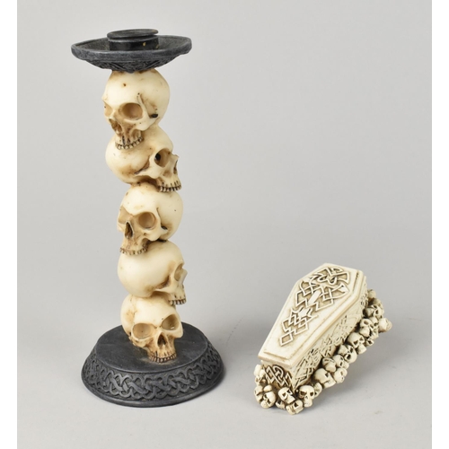 61 - A Resin Candlestick the Support Modelled with Piled Skulls, 19cms High, Together with a Small Resin ... 