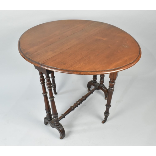 64 - An Early 20th Century Mahogany Sutherland Table with Turned Castor Supports, 76cms by 72cms High