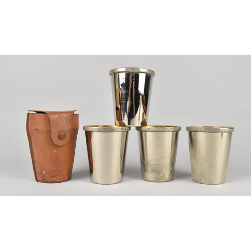 18 - A Leather Cased Set of Four Silver Plated Stacking Beakers, each 9.25cm High