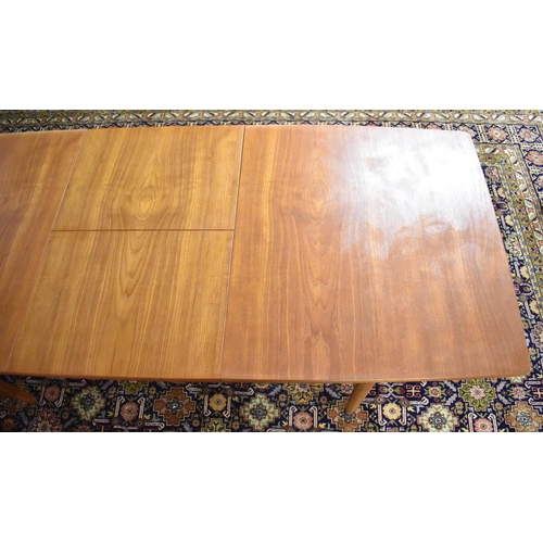 477 - A 1970s Teak Extending Dining Table on Turned Supports