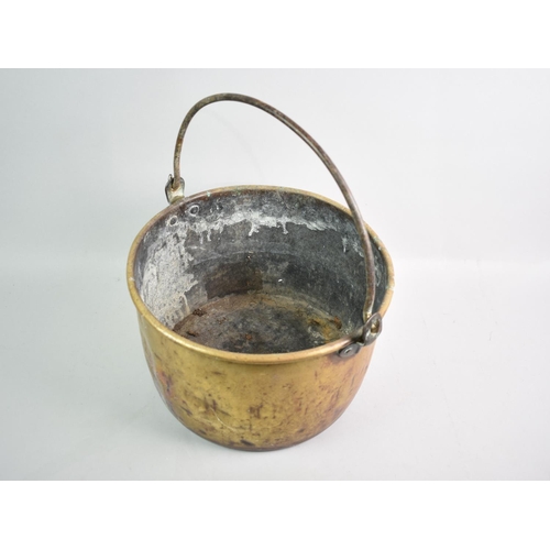 197 - A Brass Pan with Iron Loop Handle, 25cms Wide