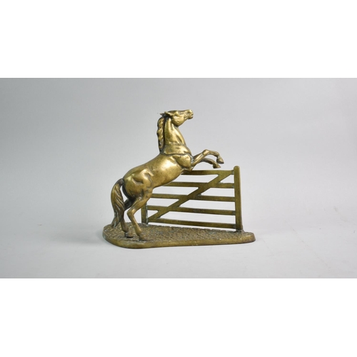 198 - A Cast Brass Study of Horse Clearing Gate, 21.5cms High