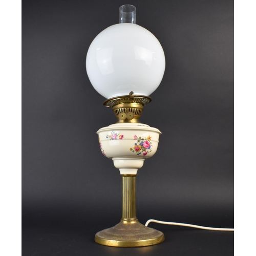 199 - A Table Lamp in the Form of a Brass Oil Lamp with Ceramic Base having Globular Shade and Chimney