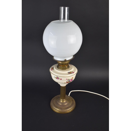 199 - A Table Lamp in the Form of a Brass Oil Lamp with Ceramic Base having Globular Shade and Chimney