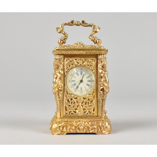 21 - A Reproduction French Style Gilt Metal Miniature Carriage Timepiece with Ornate Decoration, with Key... 