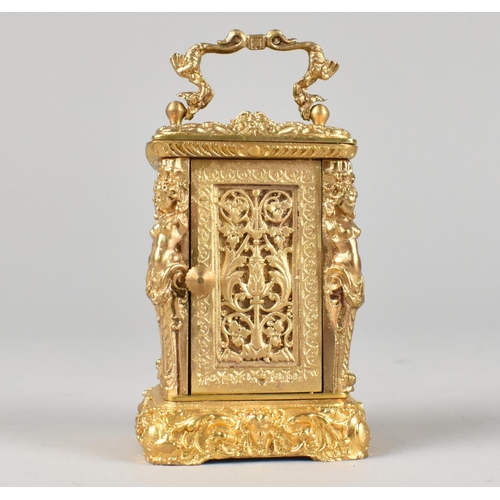 21 - A Reproduction French Style Gilt Metal Miniature Carriage Timepiece with Ornate Decoration, with Key... 