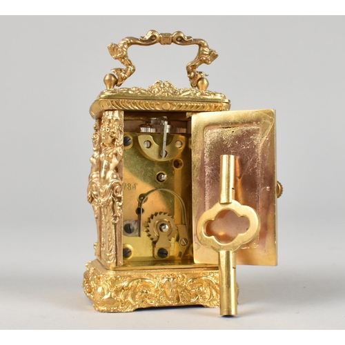 21 - A Reproduction French Style Gilt Metal Miniature Carriage Timepiece with Ornate Decoration, with Key... 