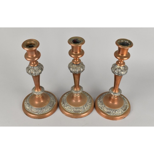 33 - A Set of Three 19th Century Sheffield Plated Candlesticks with Acanthus and Scrolled Moulded Support... 