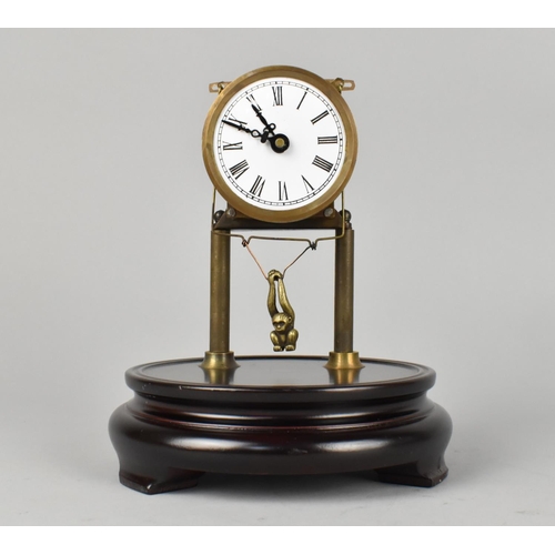 53 - A Contemporary Skeleton Clock Under Dome with Swinging Monkey Pendulum, 21cms High