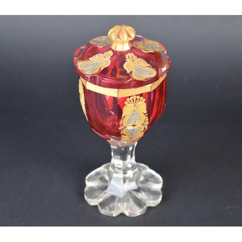 56 - A 19th Century Bohemian Cranberry Glass Goblet and Cover having Scrolled Motif Decoration in Applied... 