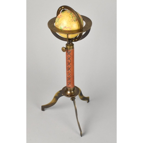 71 - A Reproduction Miniature Tabletop Globe with Leather Mounted Support and Tripod Base, 29cms High