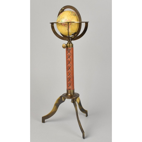 71 - A Reproduction Miniature Tabletop Globe with Leather Mounted Support and Tripod Base, 29cms High