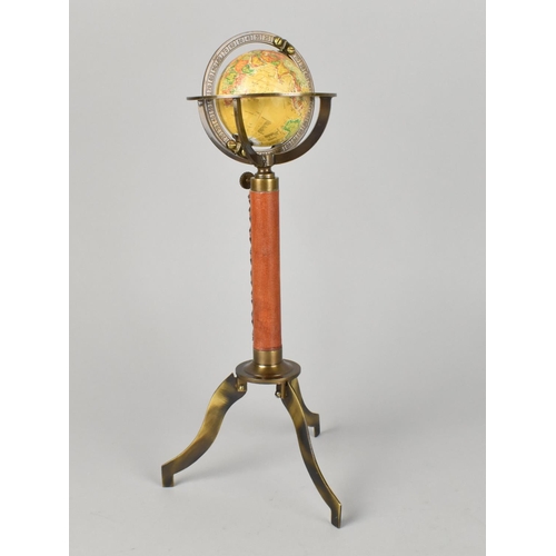 71 - A Reproduction Miniature Tabletop Globe with Leather Mounted Support and Tripod Base, 29cms High