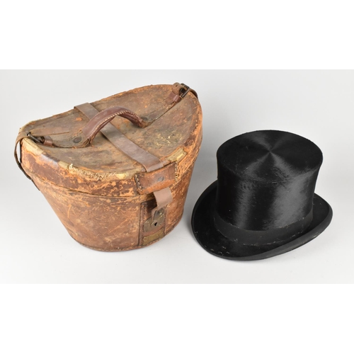 83 - An Edwardian Tress & Co, London, Top Hat (Internal Measurements 20x16cms) together with Brown Leathe... 