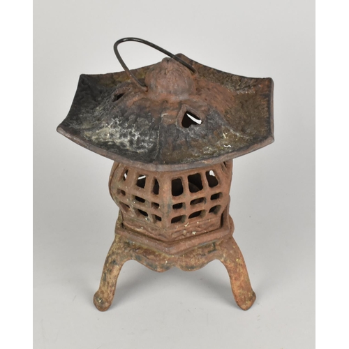 128 - A Cast Metal Lantern in the Form of a Pagoda, 26cms High