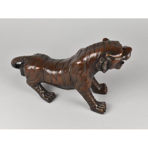 154 - A Cast Bronze Study of a Tiger, 17cms High