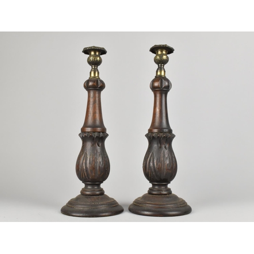 156 - A Pair of Oak and Brass Candlesticks with Carved Acanthus Supports, 34cms High