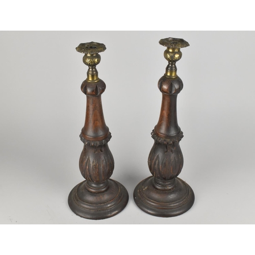 156 - A Pair of Oak and Brass Candlesticks with Carved Acanthus Supports, 34cms High