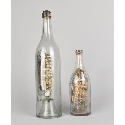 30 - A Early/Mid 20th Century Ship in a Bottle, 30cms High together with a Smaller Example, 18.5cmms High