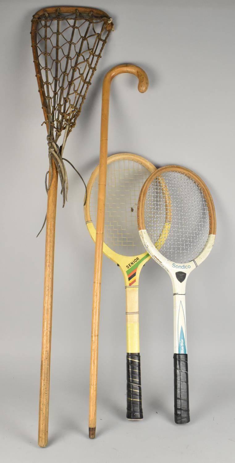 A Vintage Lacrosse Stick, Two Rackets and a Walking Stick