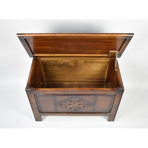 65 - A Mid Century Oak Blanket Box with Carved Front, 80.5x53.5x52cms High