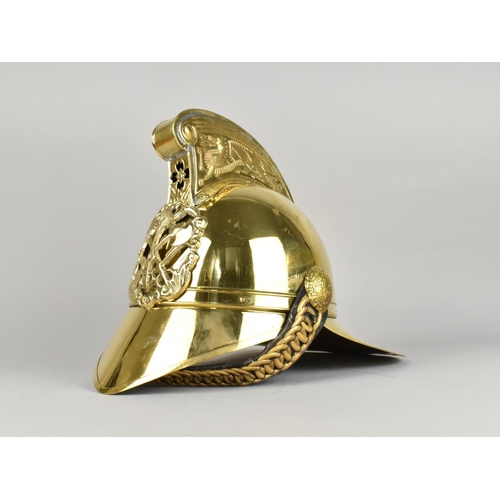 65 - A Reproduction Brass Merryweather Pattern Firemans Helmet