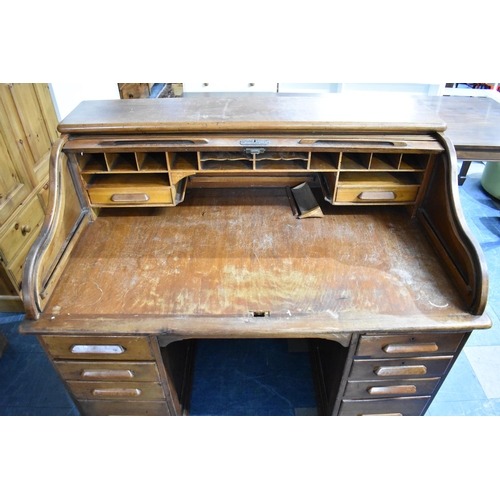 504 - An Early 20th Century American Roll Top Desk with Fitted Interior over Two Banks of Four Drawers wit... 