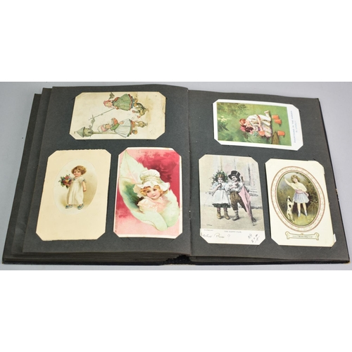 32 - A Postcard Album Containing over 200 Early 20th Century Postcards of Children