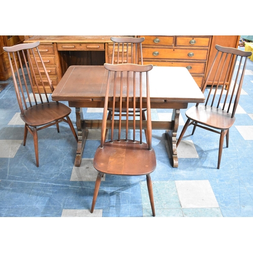 500 - A Vintage Oak Draw Leaf Dining Table and Set of Four Ercol Spindle Chairs