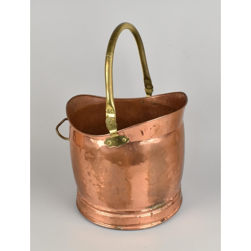 67 - A Late 20th Century Copper and Brass Helmet Shaped Coal Scuttle, 30cms Long