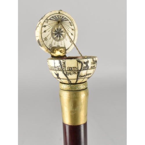 65 - A Reproduction Walking Stick with Faux Bone Finial in the Form of a Globe with Hinged Top To Sundial... 