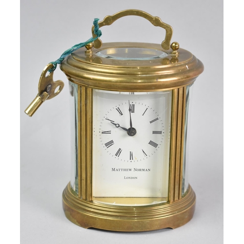 1 - A Mid 20th Century Oval Brass Cased Carriage Clock, White Enamel Dial Inscribed for Matthew Norman, ... 