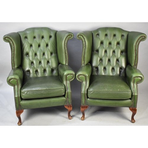 436 - A Pair of Green Leather Button Upholstered Wing Armchairs